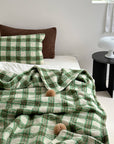 Refined Plaid Faux Lambswool Throw Blanket with Pom-Poms – Cozy & Stylish Home Décor