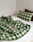 Refined Plaid Faux Lambswool Throw Blanket with Pom-Poms – Cozy & Stylish Home Décor