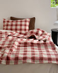 Refined Plaid Faux Lambswool Throw Blanket with Pom-Poms – Cozy & Stylish Home Décor