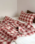 Refined Plaid Faux Lambswool Throw Blanket with Pom-Poms – Cozy & Stylish Home Décor