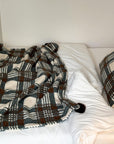 Refined Plaid Faux Lambswool Throw Blanket with Pom-Poms – Cozy & Stylish Home Décor