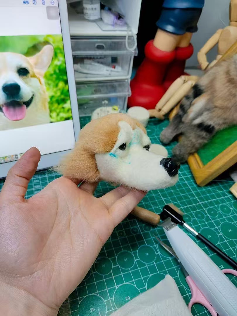Needle felting process for a custom dog portrait with tools and reference photo