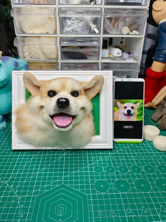 Custom 3D wool felt dog portrait in frame shown beside the pet photo